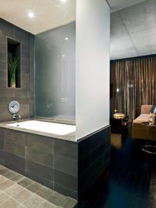 a bathroom with a bath tub in a room at Sixty LES in New York