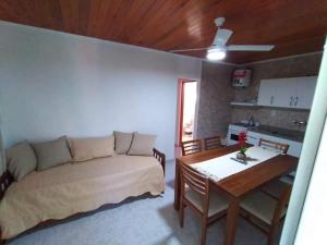 a living room with a couch and a table at Departamento Odi in Federación