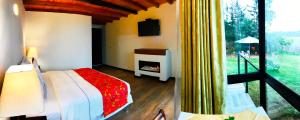 A bed or beds in a room at Lodge Estación Primavera