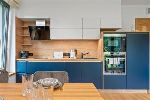 Kuchyň nebo kuchyňský kout v ubytování Residence Koubek - Útulný apartmán s výhledem a parkováním