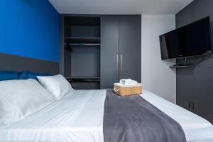 Uma cama ou camas num quarto em Apartamento especial- Icarai Niterói