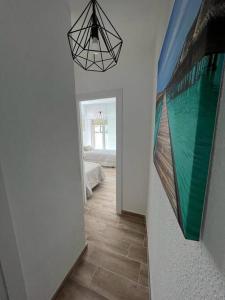 Łóżko lub łóżka w pokoju w obiekcie Apartamento céntrico y en primera línea de playa