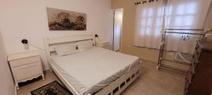 Ένα ή περισσότερα κρεβάτια σε δωμάτιο στο Los Prados Sanber +4 φωτογραφίες