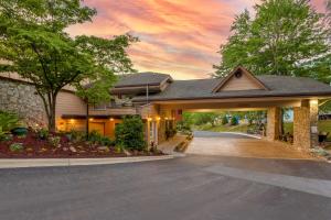 a home with a driveway leading to a garage at Best Western Smoky Mountain Inn in Waynesville