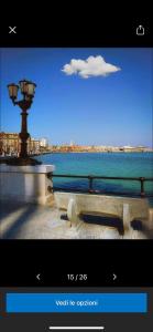 a picture of a street light next to the water at Independence house 71 in Bari