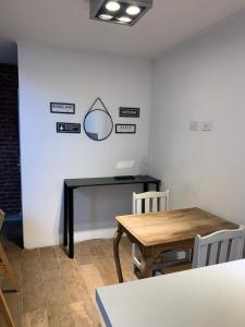 a dining room with a table and chairs at 11 de abril. Loft in Bahía Blanca