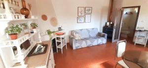 a living room with a chair and a table at Casa da Abelha- Beehouse 