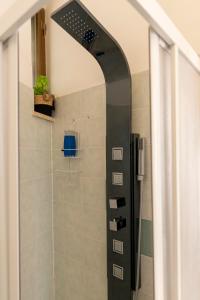 a shower with a glass door in a bathroom at Casa Domitilla Vista Mare - Spiagge, Storia & Relax Wifi - Netflix in Terracina