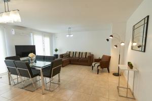 a living room with a table and a couch at VioletasNeuquen in Neuquén