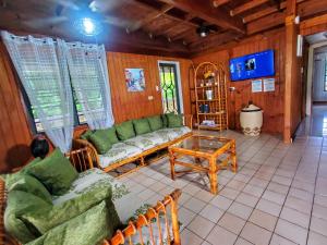 a living room with a couch and a table at Casa Grande Vacation Home and Events Venue in Rio Grande