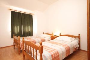 Postel nebo postele na pokoji v ubytování Apartments with a parking space Sali, Dugi otok - 8172