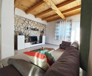 a living room with a couch and a table at Apartments with a parking space Sali, Dugi otok - 8181 in Sali