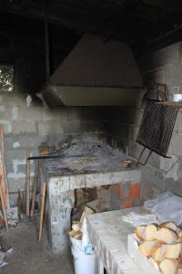 a kitchen with a stove with a bunch of bread at Apartment Kukljica 8478a in Kukljica