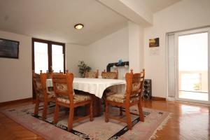 a dining room with a table and chairs at Apartments by the sea Nevidjane, Pasman - 8528 in Neviđane
