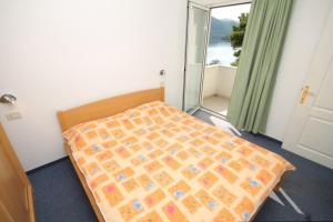 Posteľ alebo postele v izbe v ubytovaní Apartments by the sea Pasadur, Lastovo - 8388