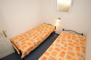 Posteľ alebo postele v izbe v ubytovaní Apartments by the sea Pasadur, Lastovo - 8388