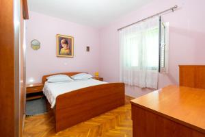 Posteľ alebo postele v izbe v ubytovaní Apartments with a parking space Kraj, Pasman - 8457