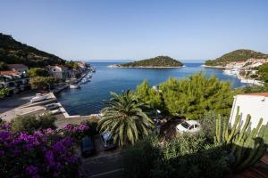 a view of a body of water with boats at Apartments and rooms by the sea Zaklopatica, Lastovo - 8339 in Lastovo