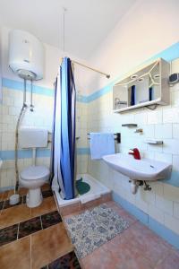 a bathroom with a toilet and a sink at Apartments with a parking space Tkon, Pasman - 8411 in Tkon