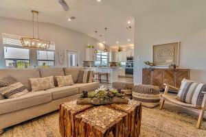 a living room with a couch and a table at Hot tub~Amazing Views~Arcade~3 bed Luxury house in Bolivar Peninsula