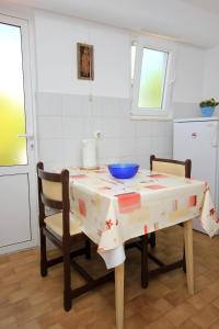 a kitchen with a table with a bowl on it at Apartments with WiFi Dubrovnik - 8590 in Dubrovnik