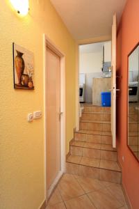 a hallway with a staircase in a house at Apartments with WiFi Dubrovnik - 8590 in Dubrovnik