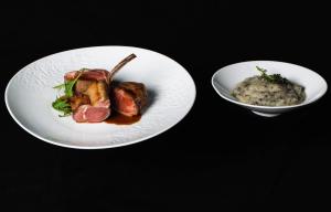 a plate of food with meat and a bowl of risotto at InterContinental Cascais-Estoril by IHG in Estoril