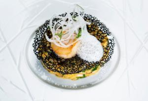 a plate of food with a desert on a table at InterContinental Cascais-Estoril by IHG in Estoril