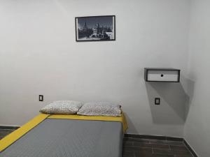 Casa de fin de semana en Teques' tesisinde bir odada yatak veya yataklar