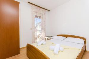 Posteľ alebo postele v izbe v ubytovaní Apartments with parking spaces Stari Grad, Hvar - 8708