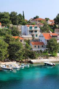 a group of boats docked in a body of water at Apartments by the sea Basina, Hvar - 8754 in Vrbanj