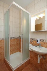 a bathroom with a shower and a sink at Apartments with a parking space Hvar - 8791 in Hvar