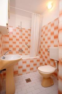 a bathroom with a toilet and a sink at Apartments and rooms with parking space Jelsa, Hvar - 8798 in Jelsa +31 photos
