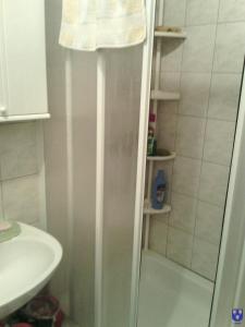 a shower with a glass door in a bathroom at Apartments with a parking space Kastel Stafilic, Kastela - 11022 in Kaštela