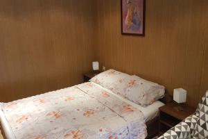 Postel nebo postele na pokoji v ubytování Apartment Lopar 10402a