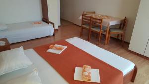 a room with a bed and a table and a dining room at Apartment Gradac 11332d in Gradac