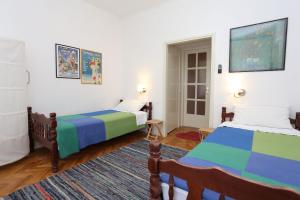 a bedroom with two beds and a rug at Twin Room Trpanj 10422b in Trpanj +11 photos