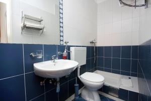 Koupelna v ubytování Apartment Pomena 10426b