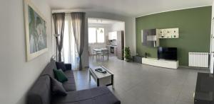 a living room with a couch and a table at Via Itria in Marsala