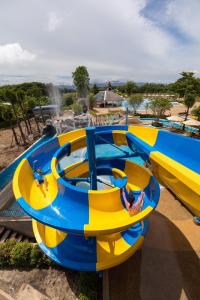 a group of slides at a water park at The Riverie by Katathani SHA Extra Plus in Chiang Rai
