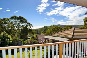 a view from the deck of a house with a white fence at Dalesview Retreat in Arakoon