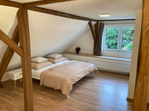 Postel nebo postele na pokoji v ubytování Apartmány u řeky Nežárky