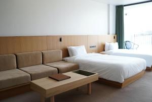 Voodi või voodid majutusasutuse Hotel Vison toas