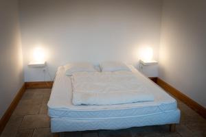 Postel nebo postele na pokoji v ubytování gîte du château