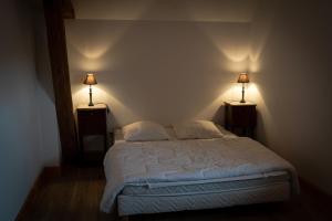Postel nebo postele na pokoji v ubytování gîte du château