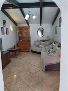 a bedroom with two beds and a table in a room at 2-Bed Villa with pool garden & parking near Seron in Serón
