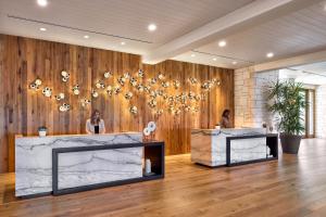 a salon with two women in a room with wood at Omni Barton Creek Resort and Spa Austin in Austin