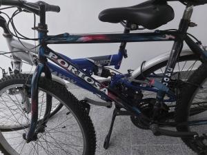 a bike parked next to a building at Porta Mare Marine in Dziwnów