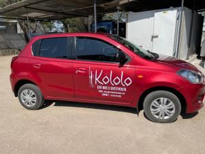 a red car with writing on the side of it at Kololo Guesthouse in Katima Mulilo