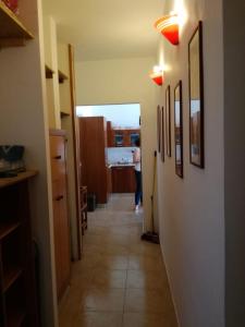 a hallway with a person walking through a room at Brancaccio’s house summer in Paola